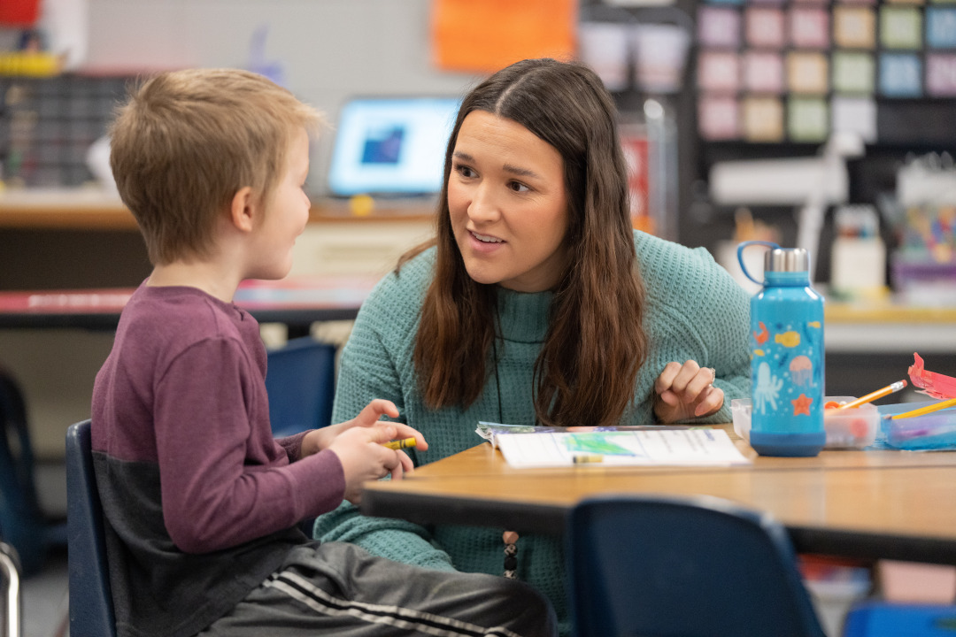 Teacher working with student