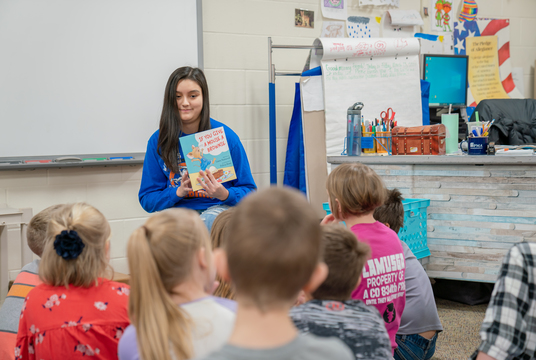 Teacher reading a story to a class