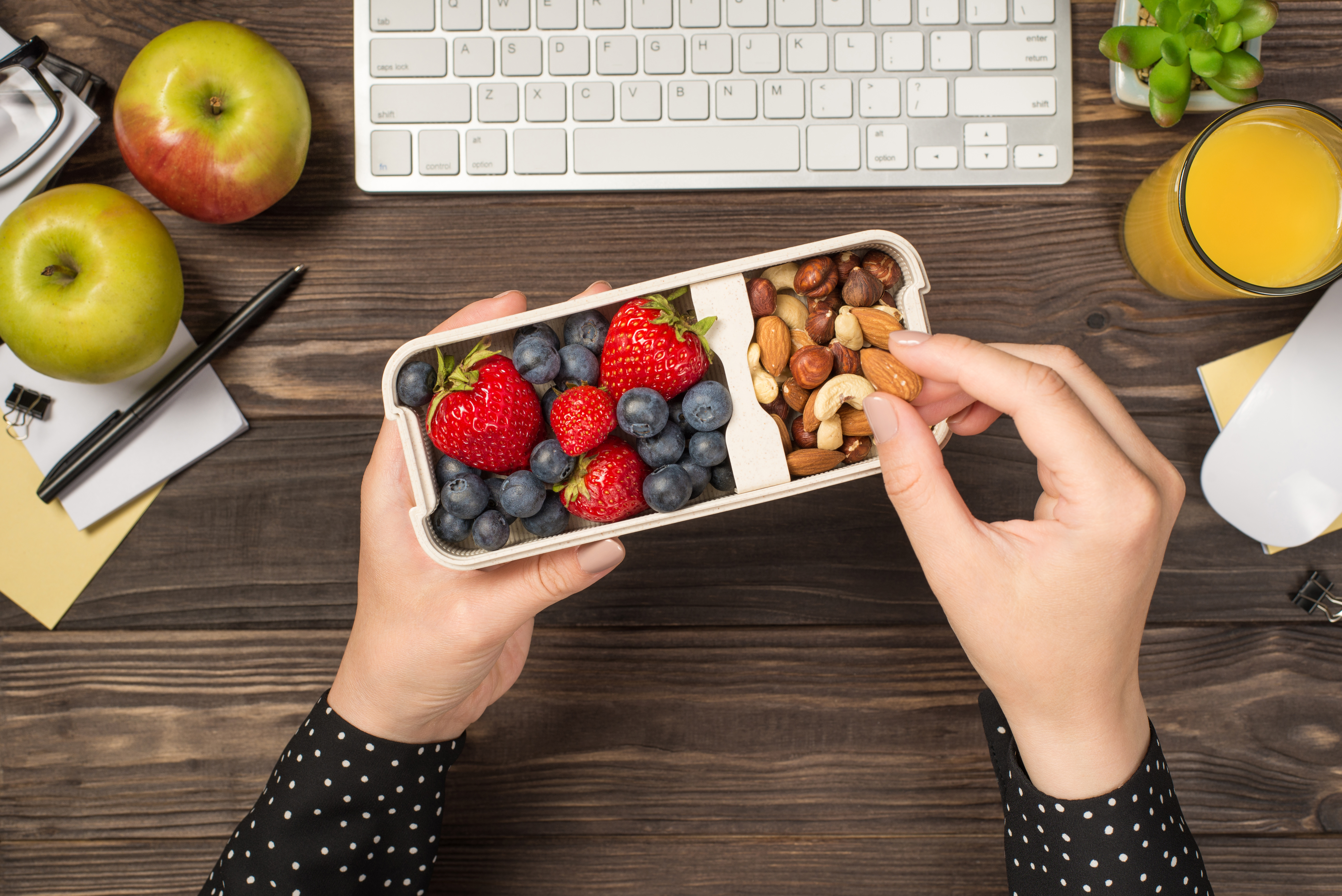 Woman eating fruits and nuts